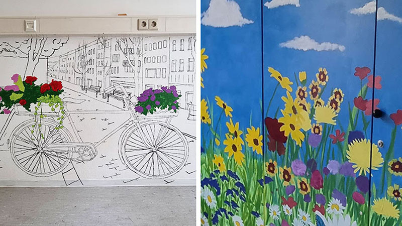 Bunte Malereien im Zukunftsraum: Eine Straßenszene mit Fahrrad und bunte Blumenmotive mit Himmel.