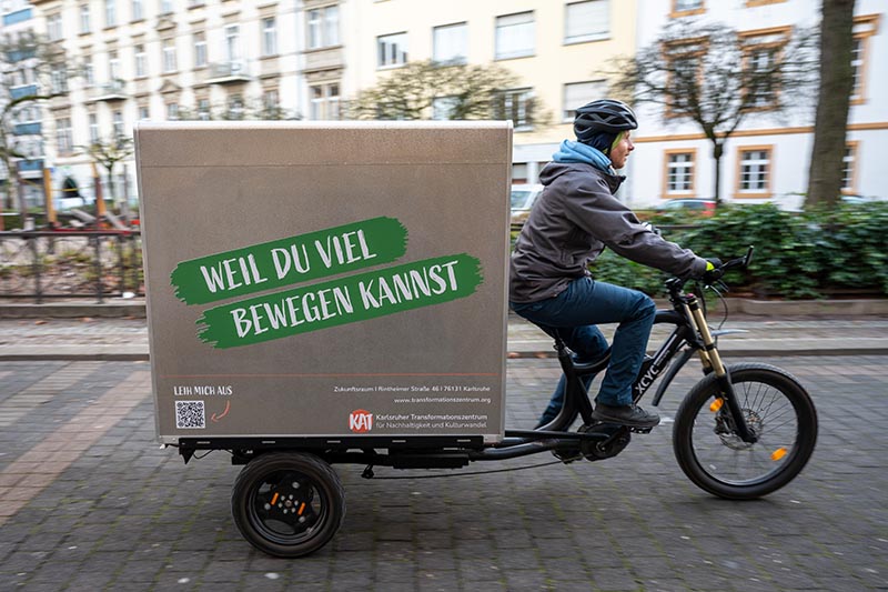 Lastenrad mit Text „Weil du viel bewegen kannst“.